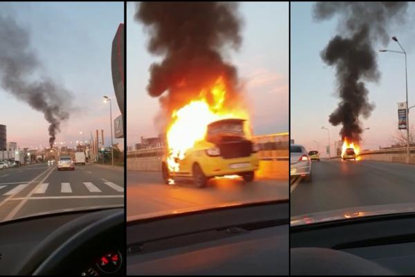 Imagini dramatice, în această dimineaţă, după ce un taxi a luat foc în mers, pe podul Pipera din Bucureşti