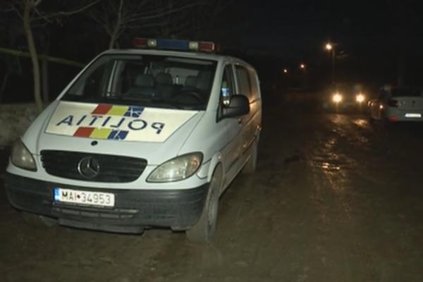 Mașină a poliției la locul unei crime