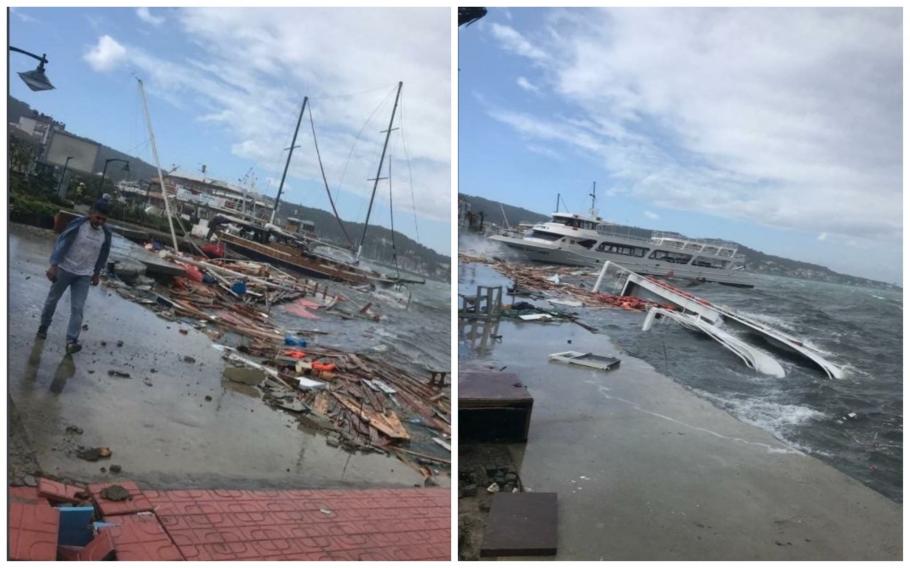 O furtună puternică a făcut prăpăd în regiunile de coastă din vestul Turciei. Peste 60 de bărci și iahturi au fost scufundate - VIDEO Un bărbat se plimbă pe un ponton, numeroase bărci sunt scufundate