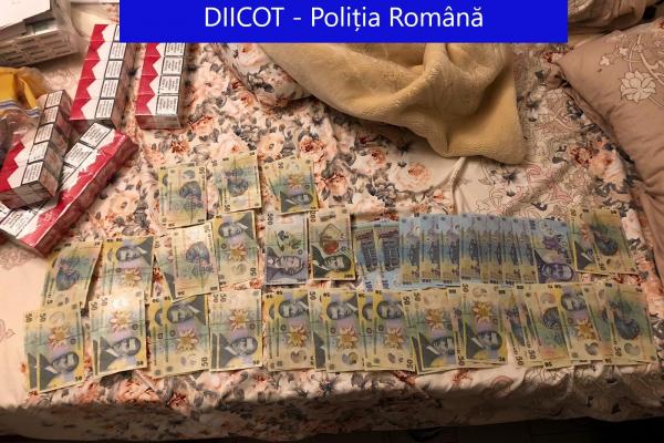 Un poliţist din Bistriţa era antemergătorul transporturilor de ţigări de contrabandă: procurorii DIICOT au destructurat reţeaua