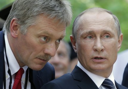 Dmitri Peskov și Vladimir Putin