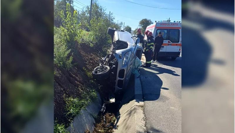 Accident grav pe o șosea din Iași. Un șofer a fost rănit, după ce s-a răsturnat cu BMW-ul în șanț. Mașina, rămasă "în aer" după impact