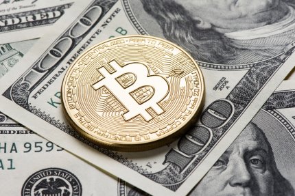 Bitcoin a atins cea mai mare valoare din 2021 încoace. Moneda a depăşit 60.000 de dolari şi se apropie de recordul absolut