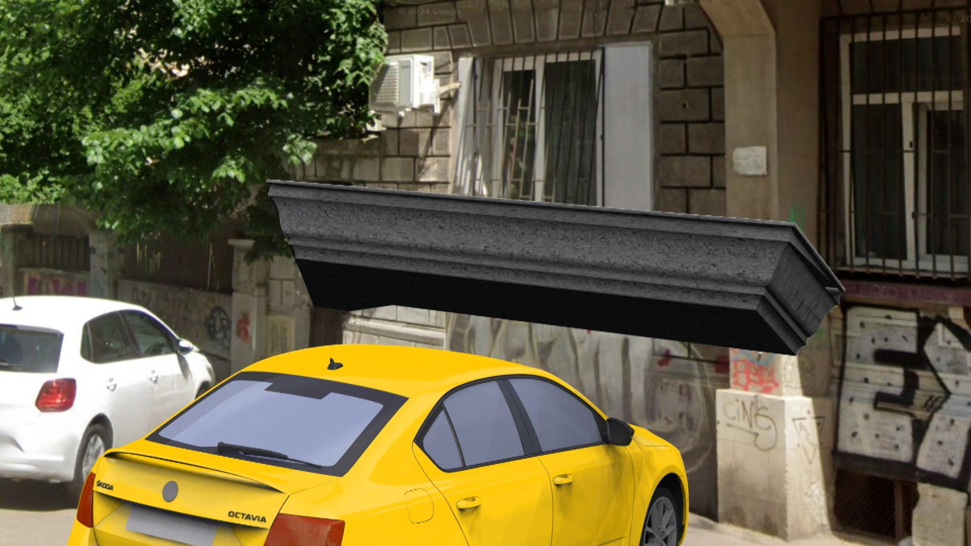 ANIMAŢIE. Maşina unui bucureştean făcută praf, după ce balconul unei clădiri a picat peste ea