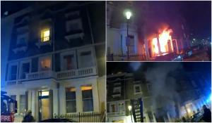 Incendiu uriaș în vestul Londrei. Momentul în care polițiștii lovesc cu piciorul ușa blocului apoi fug în clădire pentru a-i evacua pe locatari