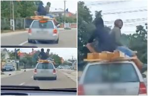 Inconştienţă fără limite: Doi bărbaţi, filmaţi pe plafonul unei maşini aflate în mers, în Suceava. Se sprijineau de nişte lemne