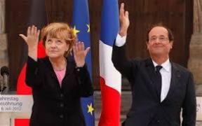 Hollande și Merkel în Place de la République, loc simbolic de omagiere a victimelor atentatelor