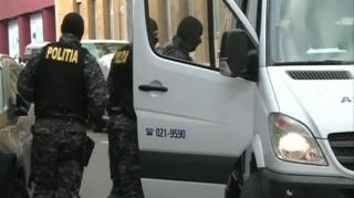 Percheziții DIICOT într-un caz de fraude cu carduri bancare