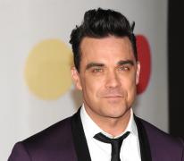 S-a accidentat cu mașina în care se afla Robbie Williams și s-a ales cu un bilet VIP