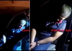 Filmare incredibilă la Iaşi. Poliţist, şef de post la Movileni, mort de beat şi plin de vomă, găsit dormind la volan, în mijlocul străzii, cu motorul pornit (VIDEO)