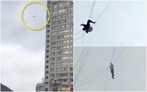 IMAGINI ŞOCANTE! A vrut să ţepuiască un hotel şi a decis să evadeze fără să plătească. A sărit şi s-a agaţat de cabluri! Urmarea este DRAMATICĂ
