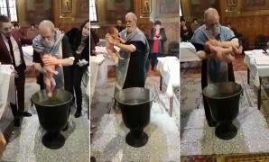 Preotul nervos de la Brăila, care a manevrat un bebeluş la botez ca pe un sac cu cartofi, a fost SUSPENDAT! Polițiștii au intrat pe fir (VIDEO)