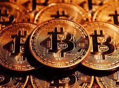 Creştere spectaculoasă a monedei Bitcoin. Valoarea unei criptomonede a sărit de 12.000 de dolari!