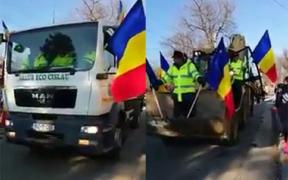 În urma unui pluton de militari au defilat maşinile de gunoi