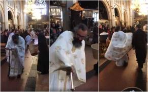 Un preot binecuvântează enoriaşii de pe trotinetă! Imagini inedite surprinse în biserică, în a doua zi de Paşte (Video)