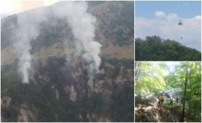 Două elicoptere şi forţe suplimentare din alte judeţe chemate să stingă incendiul din Parcul Naţional Domogled