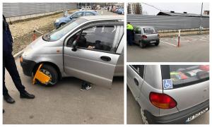 Bătrân cu handicap, umilit de un paznic în parcarea unui magazin din Bucureşti