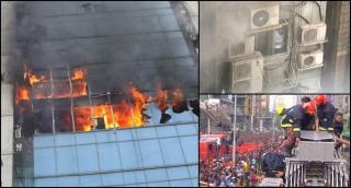 Zeci de morţi după ce un incendiu uriaş a curprins o clădire de birouri. Oamenii s-au aruncat pe geam ca să scape de flăcări (Video)