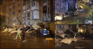 Dezastru în Craiova după o furtună violentă. Acoperişul unui bloc a ras mai multe balcoane şi s-a prăbuşit peste maşini (Video)