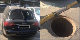 Un capac de canal sărit în aer a distrus luneta unui Audi, în București