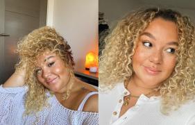 Grace Victory zâmbind, având părul creţ, blond şi purtând o bluză albă