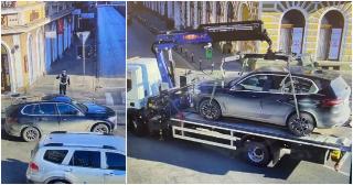 Mașină, ridicată de polițiști din fața unui hotel, în Satu Mare