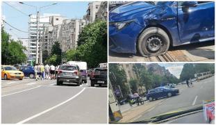 Un poliţist pe motocicletă, lovit de un şofer în centru Capitalei