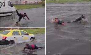 O stradă din Mediaş, transformată în piscină. Un bărbat a fost filmat în timp ce înota printre maşini