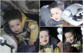 Inocența copilăriei: Abia scos de sub dărâmături, Karam, un băiețel din Siria le-a zâmbit salvatorilor și a început să se joace cu ei