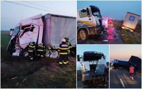 Dezastru pe o șosea din Arad. Două TIR-uri s-au ciocnit frontal între Periam și Satu Mare, unul dintre șoferi a rămas încarcerat