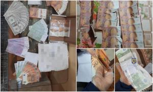 Peste 150.000 de euro falși, descoperiți în urma unor percheziții făcute în mai multe județe. 21 de persoane, audiate