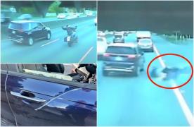 Momentul în care un șofer de SUV "șterge pe jos" cu un motociclist, pe o autostradă din SUA