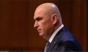 Bolojan taie banii şi pentru deplasările externe ale Guvernului: mai puţine şi mai mici