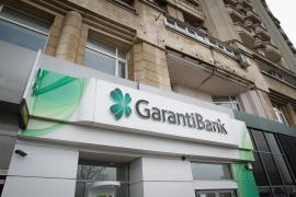 Garanti Bank dispare din România. Raiffeisen Bank, la un pas să o preia