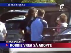 Robbie Williams vrea sa adopte un copil