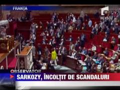 Sarkozy,incoltit de scandaluri