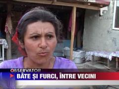 Bate si furci, intre vecini