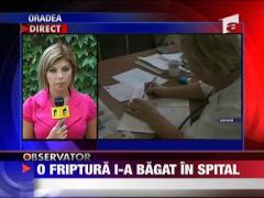 O friptura i-a bagat in spital