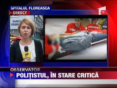 Politistul batut, in stare critica