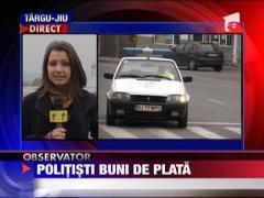Politisti buni de plata