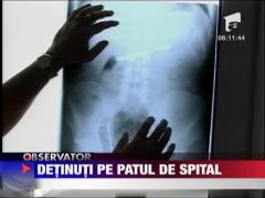 Detinuti pe patul de spital