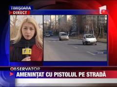Amenintat cu pistolul la tampla