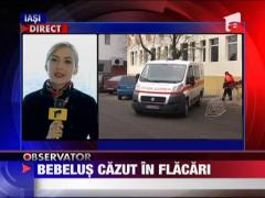 Bebelus cazut in flacari