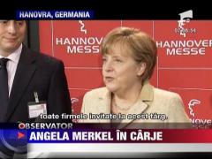 Angela Merkel, deplasare in carje