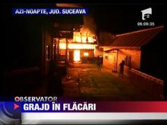 Grajd mistuit de flacari