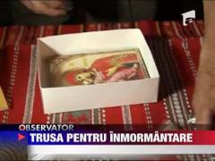 Biserica a scos spre vanzare truse de inmormantare