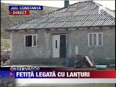Fetita de 12 ani, tinuta in lanturi