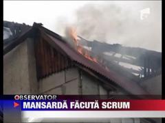 Mansarda mistuita de flacari