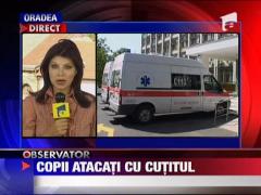 Copii batuti si taiati cu un cutit de catre un vecin