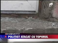 Politist atacat cu toporul